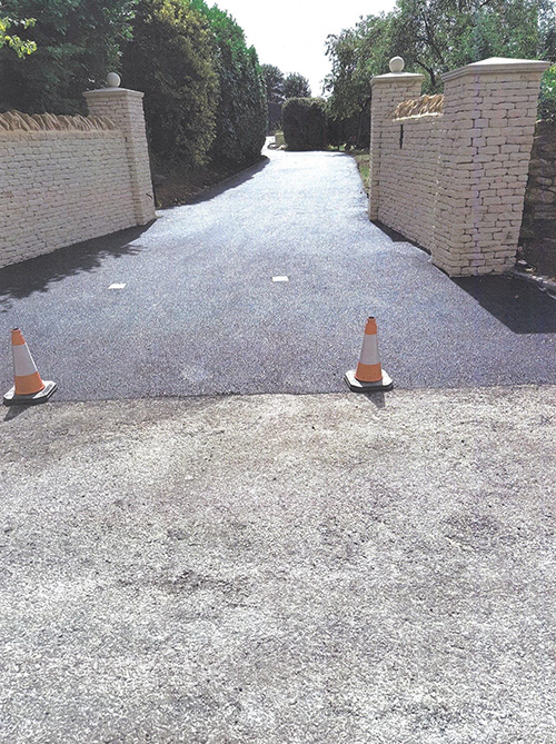 Laying binder course and S M A to new driveway