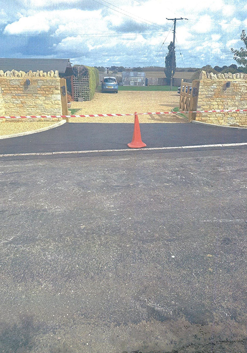 Surfacing of new drop kerb